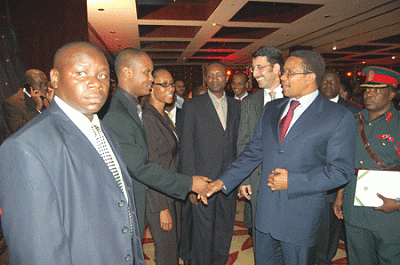 Costantine Magavilla, who is also Marketing Manager – Segments for Celtel, exchanges greetings with HE Jakaya Mrisho Kikwete, President of the United Republic of Tanzania after the successful launch of Blackberry in Tanzania by Celtel. The President